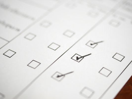 check signs boxes checked on white piece of paper background check service truthfinder features